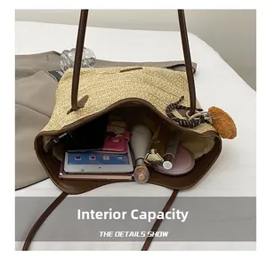 Detailed internal capacity view of beige straw tote bag showing tablet and essentials