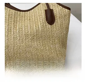 Detailed close-up of high-quality woven straw texture and premium brown leather stitching