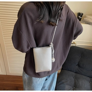 Silver-grey pebble leather mini crossbody phone bag with thin strap and knot detail