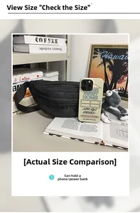 Macro view of a black nylon crossbody bag showing its interior capacity with a phone