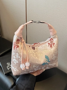Pink embroidered canvas hobo bag with traditional Chinese patterns and beaded handle