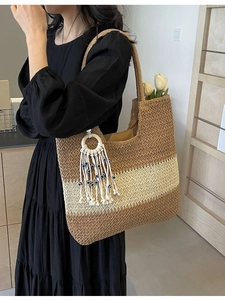 Three-color woven tote bag with tassel and evil eye charm for beach vacations