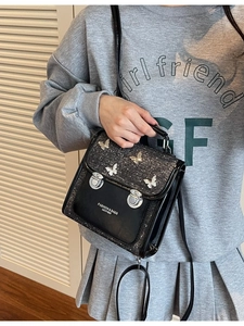 Fashionable black PU leather backpack with silver butterfly decor for women