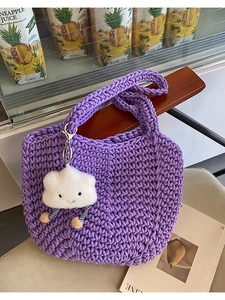 Handcrafted purple woven tote bag with a cute white plush cloud charm for summer travel