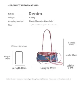 Detailed size comparison of denim handbag with lace bows against a smartphone