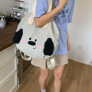 Close-up of beige nylon tote bag featuring cute 3D plush ears and dog cartoon embroidery