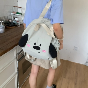 Detail of cute grey nylon backpack featuring 3D dog ears and cartoon embroidery