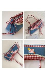 Detail of denim and red gingham shoulder bag featuring lace trim and cherry embroidery