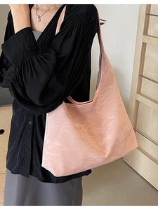 Pink large capacity tote bag with glossy wrinkled texture and wide shoulder strap