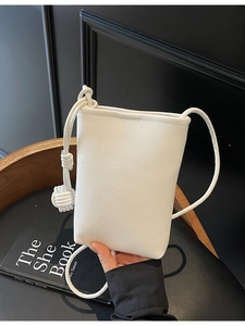 Minimalist white litchi pattern leather phone bag with unique knotted strap details