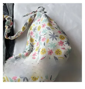 Detail shot of Oxford cloth bag featuring delicate floral patterns and fine stitching work