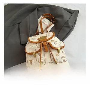 Detail of vintage beige bucket bag with KMKA prints and magnetic flap pockets