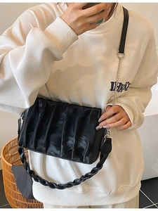 Chic black pleated hobo bag with silver chain and woven strap for elegant women