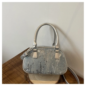 Detail of silver sequins and grey denim fabric on this stylish mini Boston handbag
