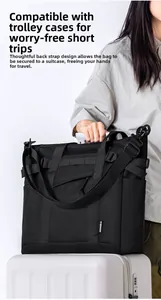 Travel bag with back trolley sleeve attachment shown on a white luggage handle