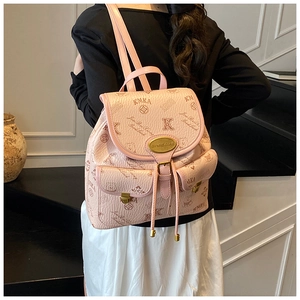Detail of pink backpack with all-over logo pattern, drawstring closure and magnetic buckles