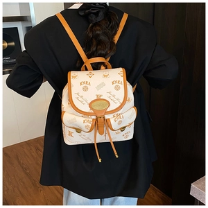 Rear view of a model wearing the mini bucket backpack with cartoon bear patterns