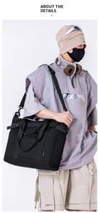 Close-up of durable black nylon tote bag featuring adjustable strap and MONGKA branding