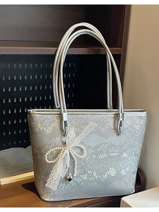 Silver snakeskin tote bag with double handles and lace pearl heart charm pendant