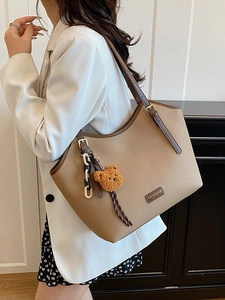 Retro large capacity khaki leather tote bag with brown straps and plush bear charm