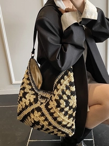 Handmade crochet tote bag with geometric pattern and black leather shoulder strap