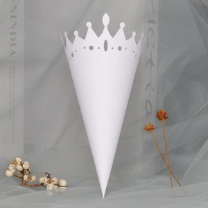 Macro detail of white lace hollow cone for wedding petals and confetti decorations