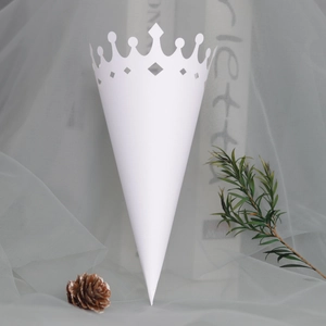 Close-up of white hollow crown lace paper cone for wedding petals and dry flowers