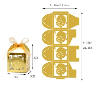 Detail view of 5x5x8cm golden paper candy box with laser cut sheep and ribbon