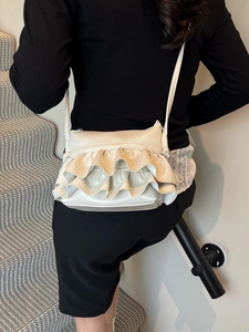 Chic cream white pleated crossbody bag for women featuring stylish ballet ruffles on leather