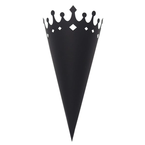 Detail of a black crown-shaped laser-cut cone for wedding petals or party favors