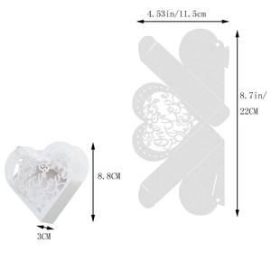 Macro view of white heart hollow gift box with One Love laser cut design and satin ribbon