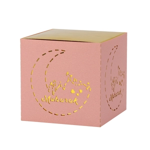 Detail of laser-cut moon and mosque patterns on pink Eid Mubarak gift box