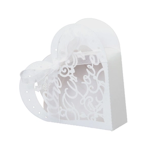 Detailed laser-cut heart candy box with Love motif and white ribbon for wedding favors