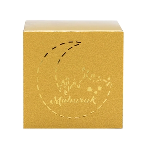 Detail of a golden square gift box with a moon design and Mubarak festive typography