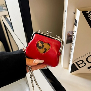 Mini red heart coin purse with leopard print cutout and silver chain strap details