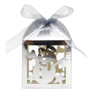 Detail of silver snowman cutout gift box with festive blue ribbon and star patterns