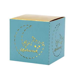 Detailed laser cut crescent moon and Mubarak lettering on dark blue square gift box