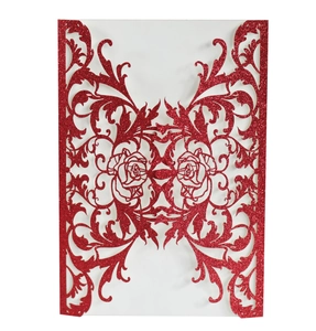 Detailed laser-cut rose pattern on red glitter wedding invitation card with intricate edges