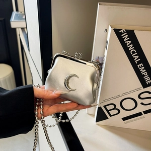 Mini silver metallic bag with crescent moon detail and detachable pearl chain strap