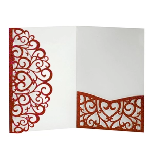 Detailed laser cut lace wedding invitation cover with red glitter and white floral pattern
