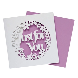 Detail of laser-cut white and purple greeting card with Just for You floral pattern