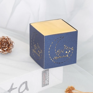 Dark blue and gold Ramadan Mubarak favor box with laser-cut moon and mosque design