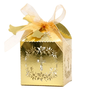 Golden hollow cross candy box with laser-cut floral wreath and elegant organza ribbon bow