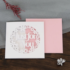 Detailed laser-cut hollow pink daisy card with Just for You text on grey net background