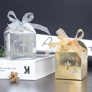Detailed laser-cut cross hollow pattern on gold and silver wedding favor gift boxes