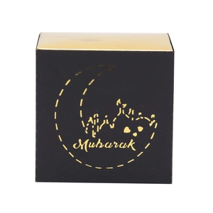 Close-up of square black Eid Mubarak gift box with gold foil moon and lettering detail