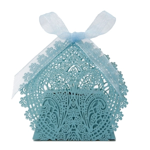 Detailed laser-cut hollow lace pattern on a light blue gift box with an organza ribbon