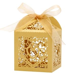 Golden laser-cut heart candy box with pearl paper finish and matching ribbon bow