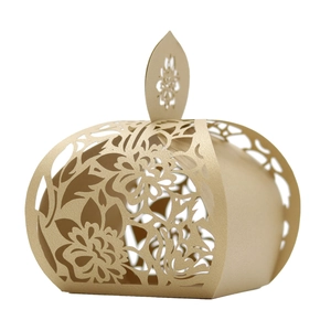 Detailed laser-cut champagne gold floral favor box with intricate hollow design