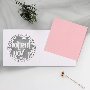 Detail of laser-cut floral daisy greeting card with Just for You pink insert